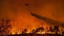 A helicopter fighting a wild fire
