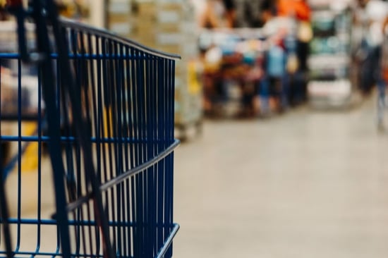 Grocery cart in store aisle