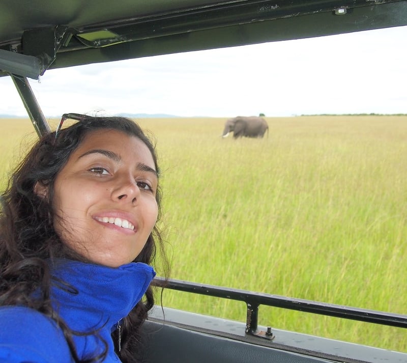Tiffany on a safari with an elephant in the background