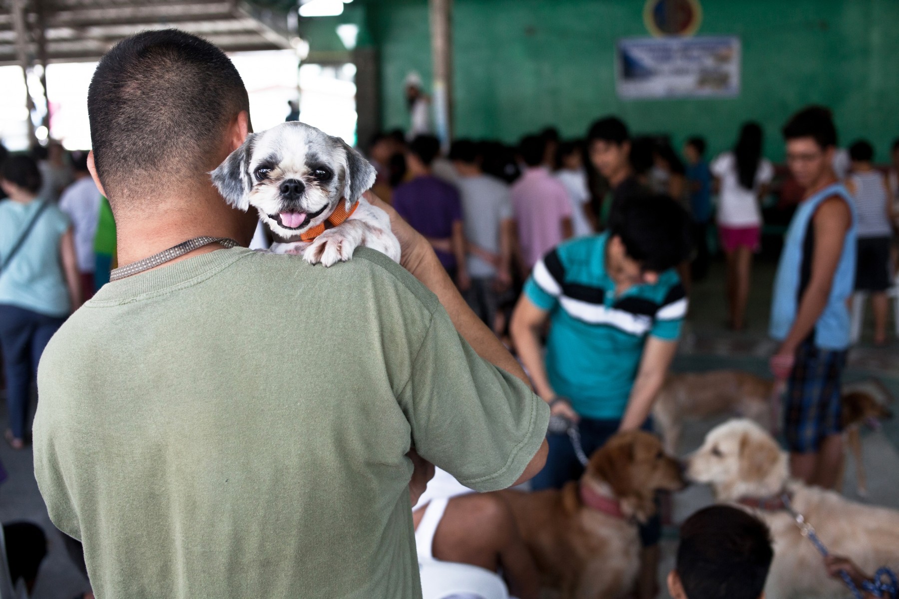 Owner holding his dog at a rabies vaccination drive in the Philippines - World Animal Protection