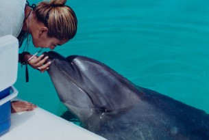 Makaiko the dolphin with former trainer Lorena Kya Lopez - World Animal Protection