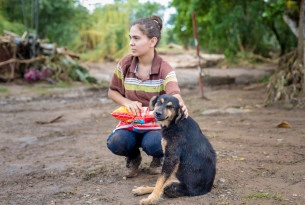 Woman with dog in Costa Rica after Hurricane Otto - World Animal Protection