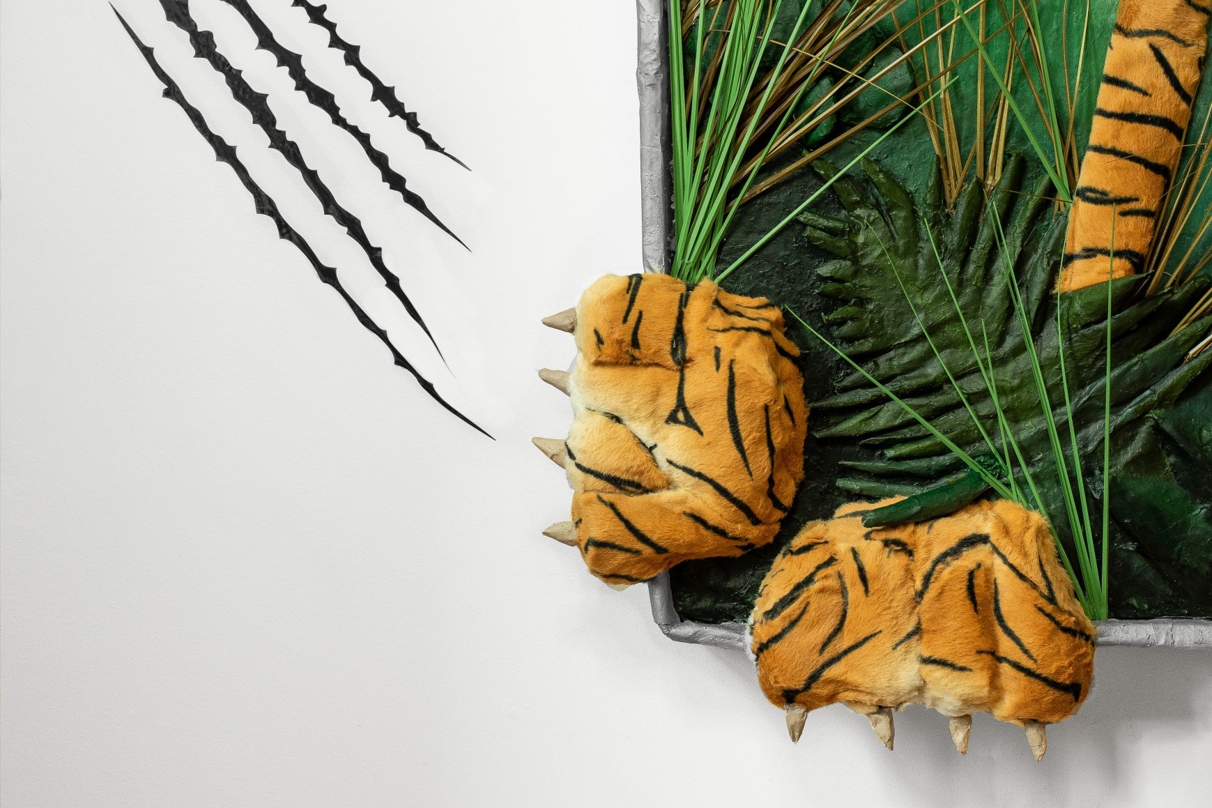 Mixed media sculpture of a tiger trying to escape a selfie frame by Briony Douglas