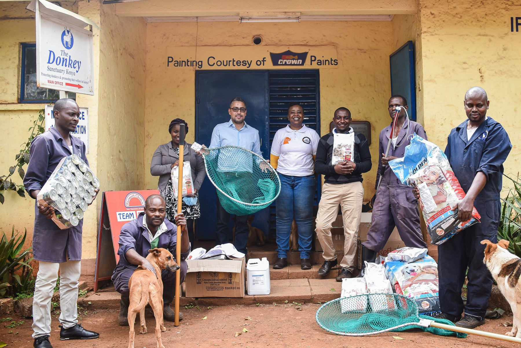 Emily Mudoga (Companion Animal Campaign Manager) giving World Animal Protection donations to the Kenya Society for the Protection and Care of Animals.